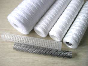 Yarn wound string filter cartri